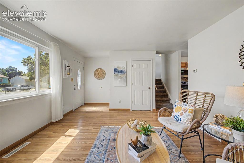 Image 4 of 37: Main floor living room, foyer and coat closet 