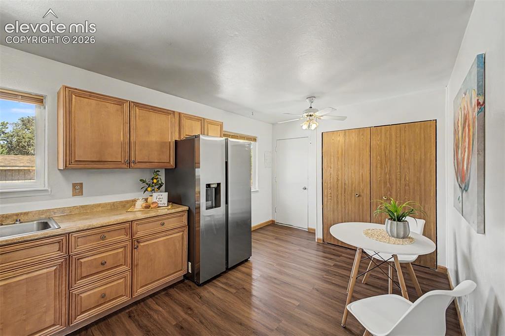 Image 5 of 37: Kitchen with updated cabinets, newerr stainless steel appliances, and a mos