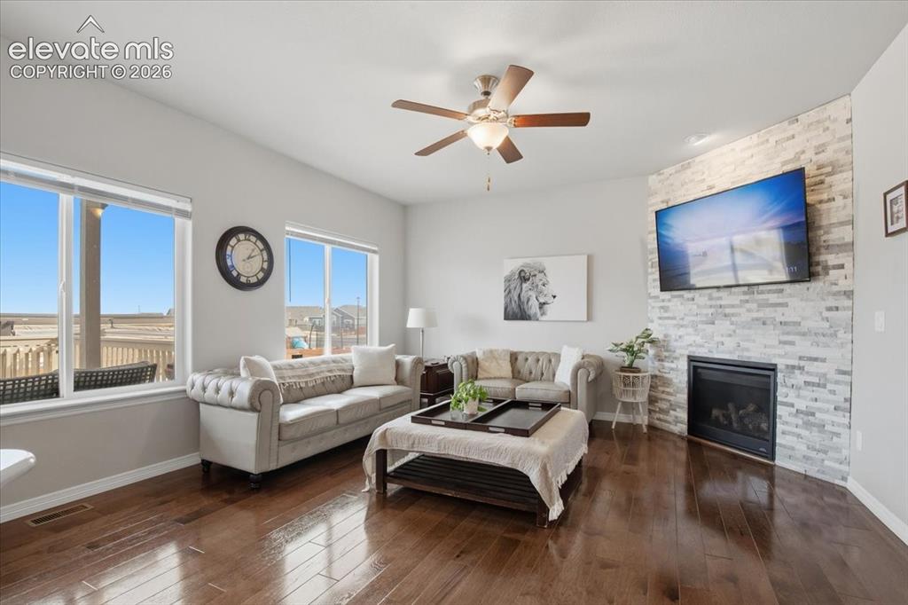 Image 3 of 31: Wood-finish flooring throughout, ceiling fan with integrated lighting, buil