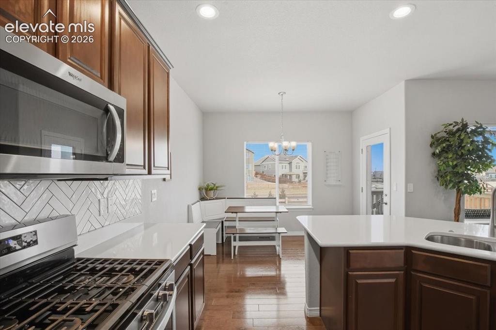 Image 7 of 31: Stainless steel microwave and gas range