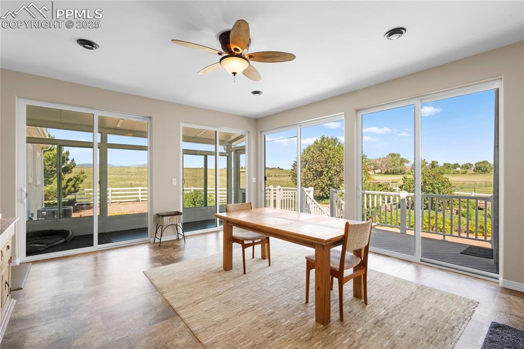 Image 10 of 45: Dining room featuring a ceiling fan