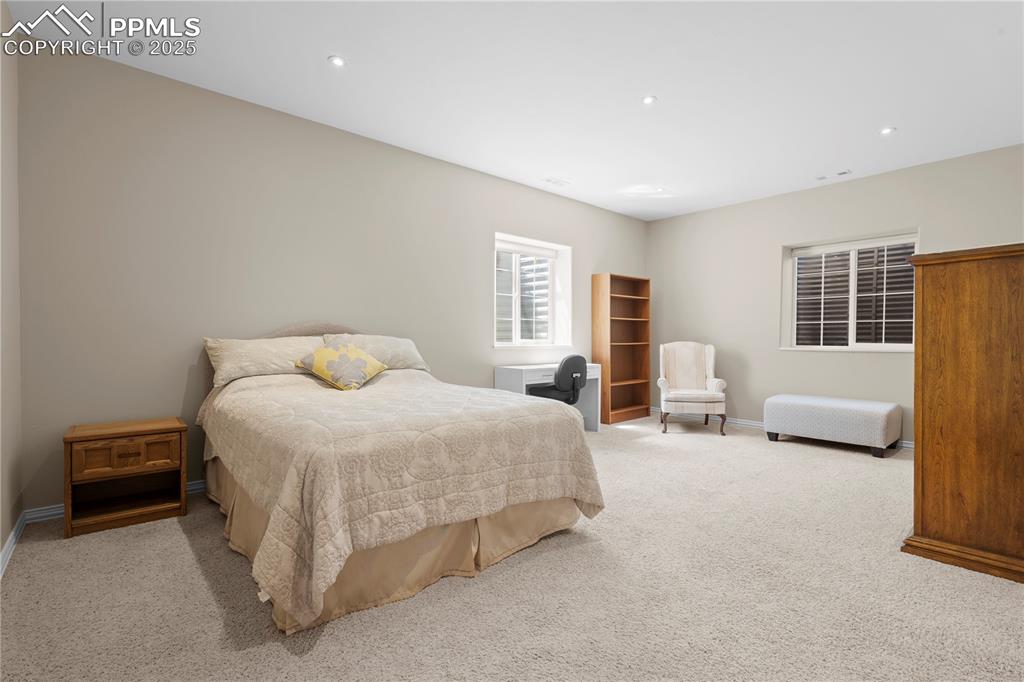 Image 21 of 45: Carpeted bedroom featuring baseboards and recessed lighting