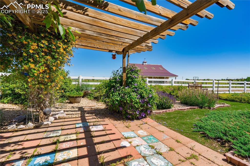 Image 28 of 45: View of patio / terrace with a pergola