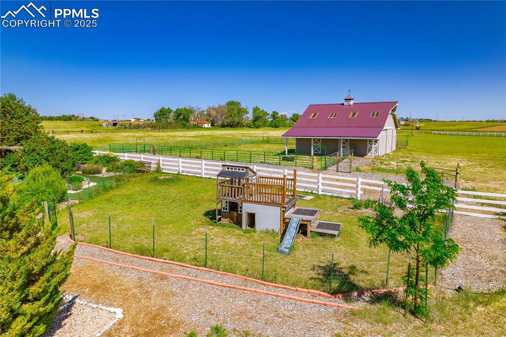 Image 33 of 45: View of yard with an outdoor structure, a view of countryside, and an exter