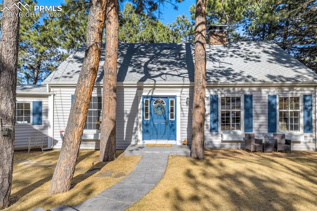 Caption: Stunning Cape Cod style home set on a picturesque 1.91 acre lot in Academy School District 20