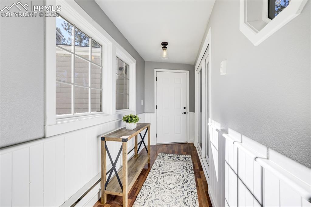 Image 18 of 50: Breezeway/mudroom connecting
the two car garage to the main
house
