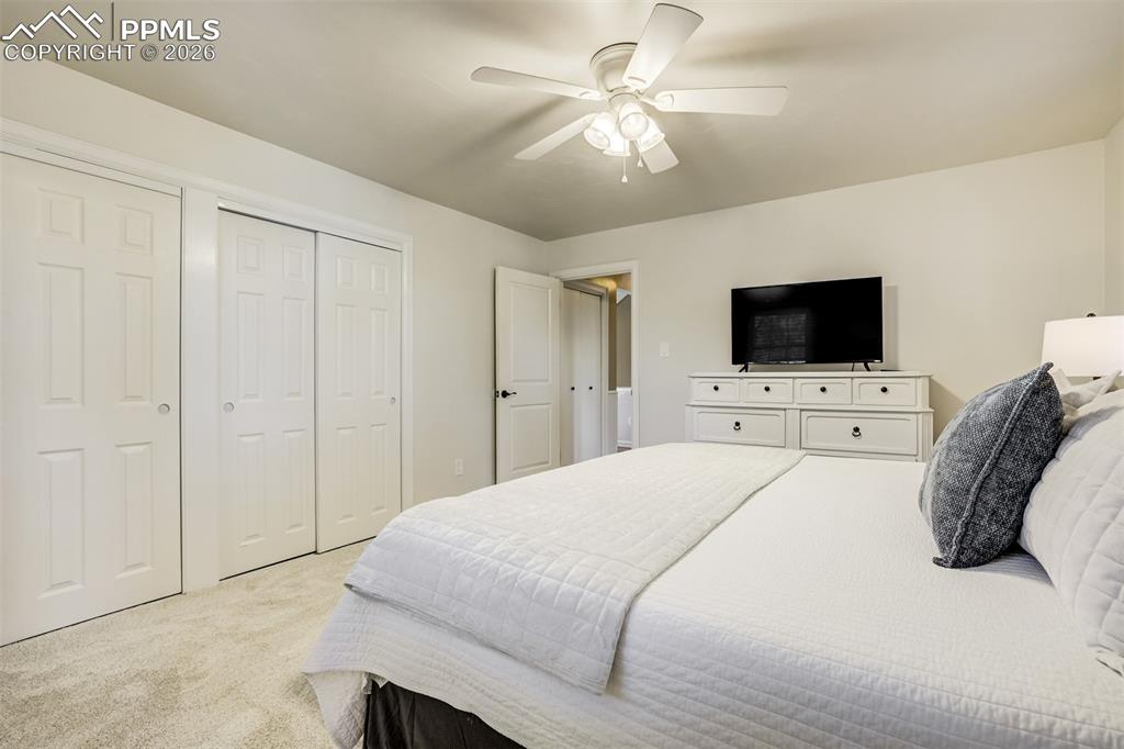 Image 22 of 50: Main level primary bedroom with multiple closets