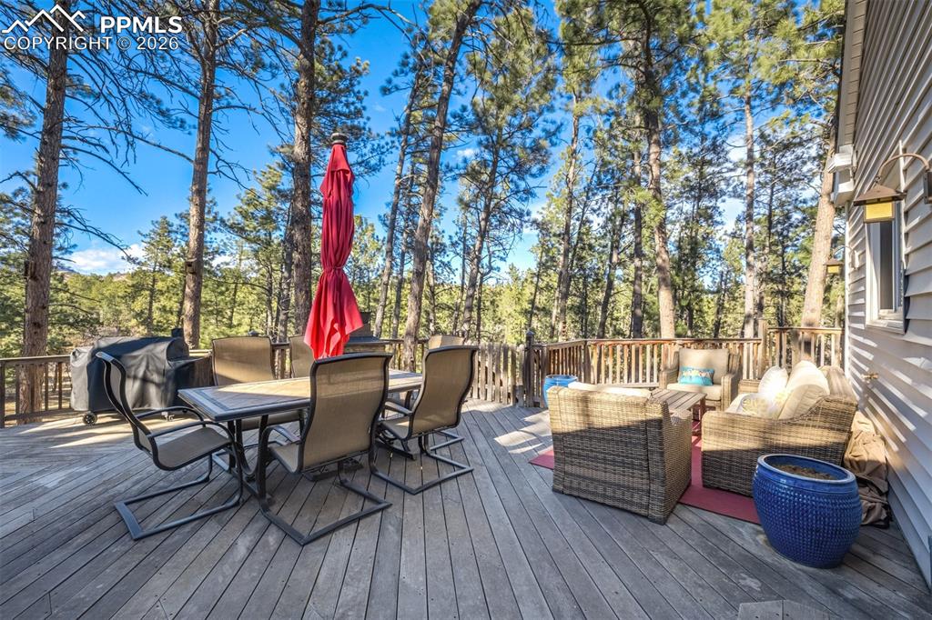 Image 37 of 50: Brazilian hardwood deck with outdoor dining area, a Jacuzzi hot tub