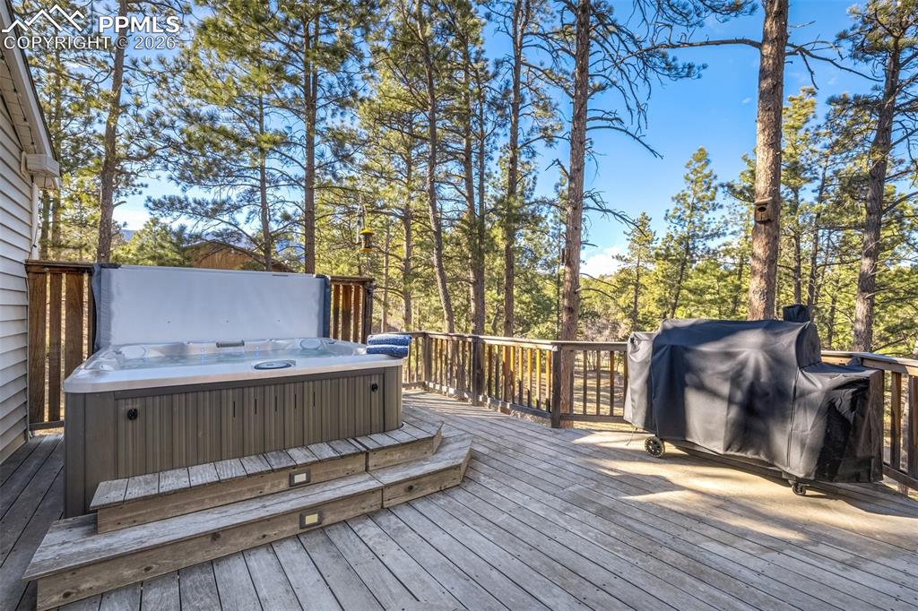 Image 38 of 50: Brazilian hardwood deck with outdoor dining area, a Jacuzzi hot tub