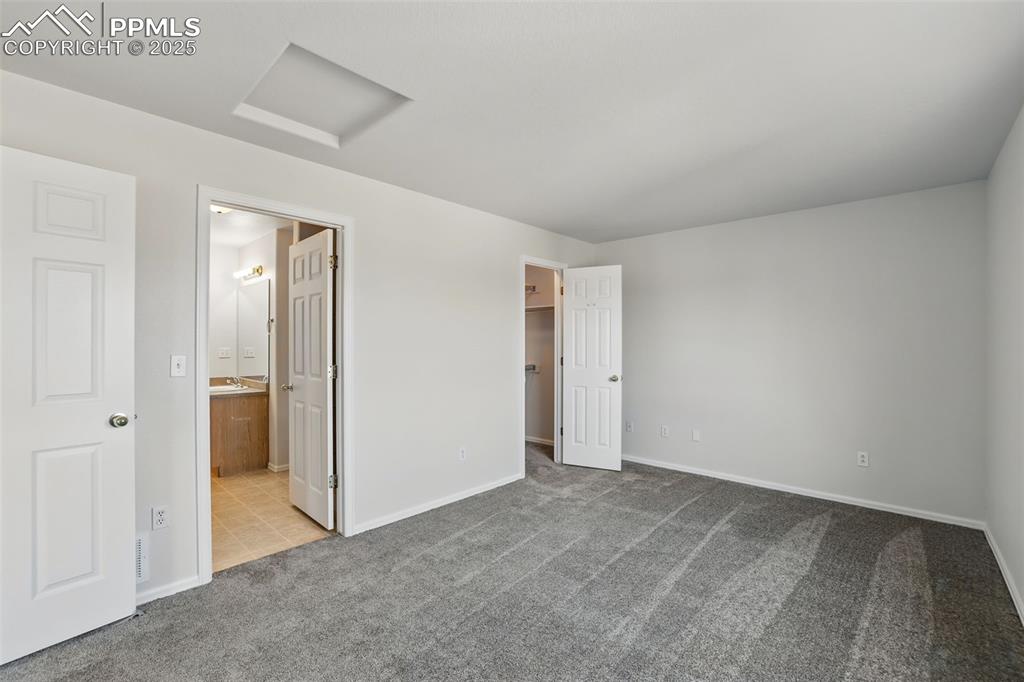 Image 25 of 50: Master bedroom with adjoining bath & walk in closet