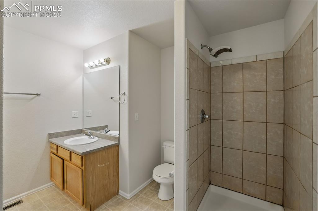 Image 30 of 50: 5 Piece master bathroom featuring dual vanity, stand alone ceramic surround