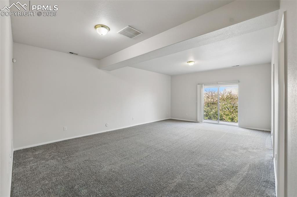 Image 36 of 50: Basement family room with walk out