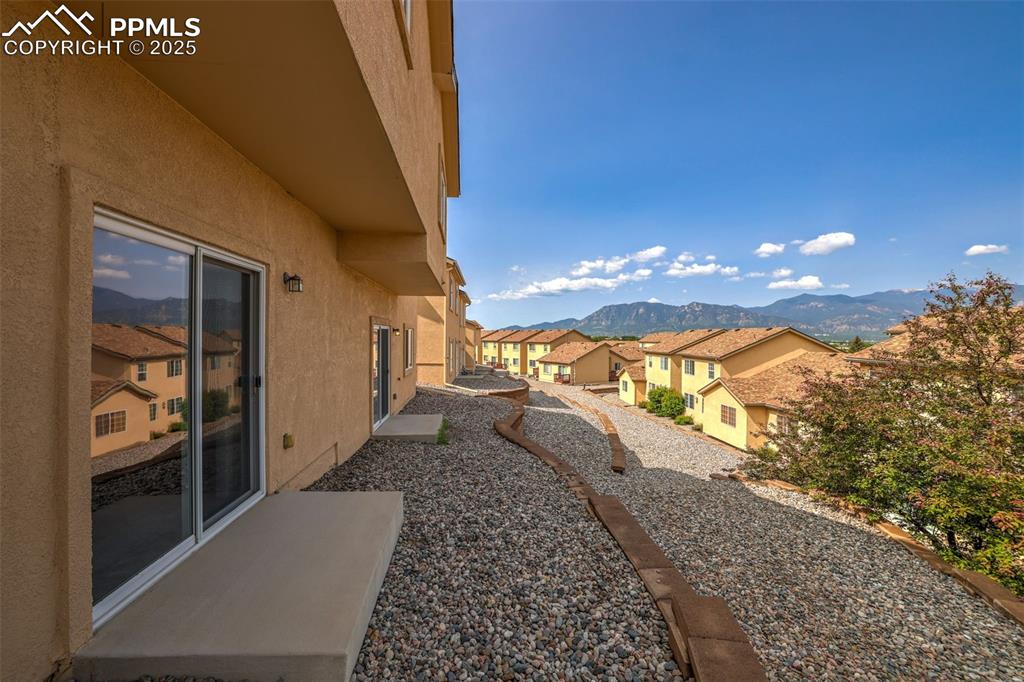 Image 39 of 50: View of rear yard with a mountain range view