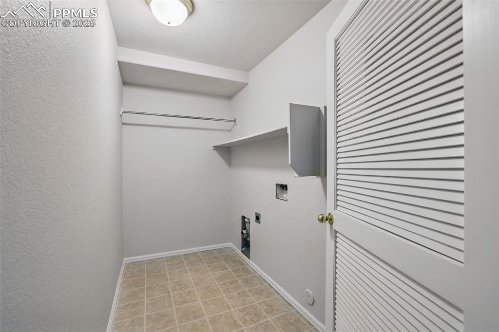 Image 45 of 50: Laundry area with washer hookup & electric dryer hookup