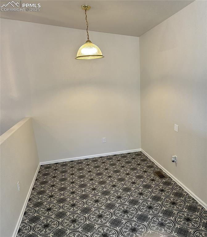 Image 50 of 50: Spare room with baseboards