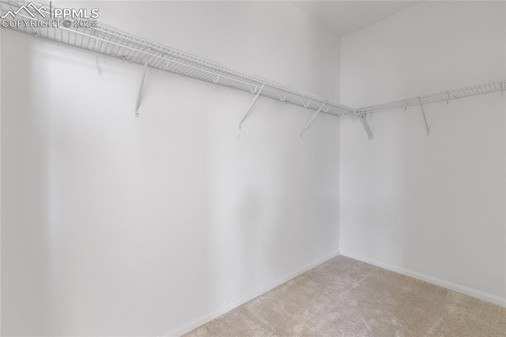 Image 25 of 37: Primary walk-in closet