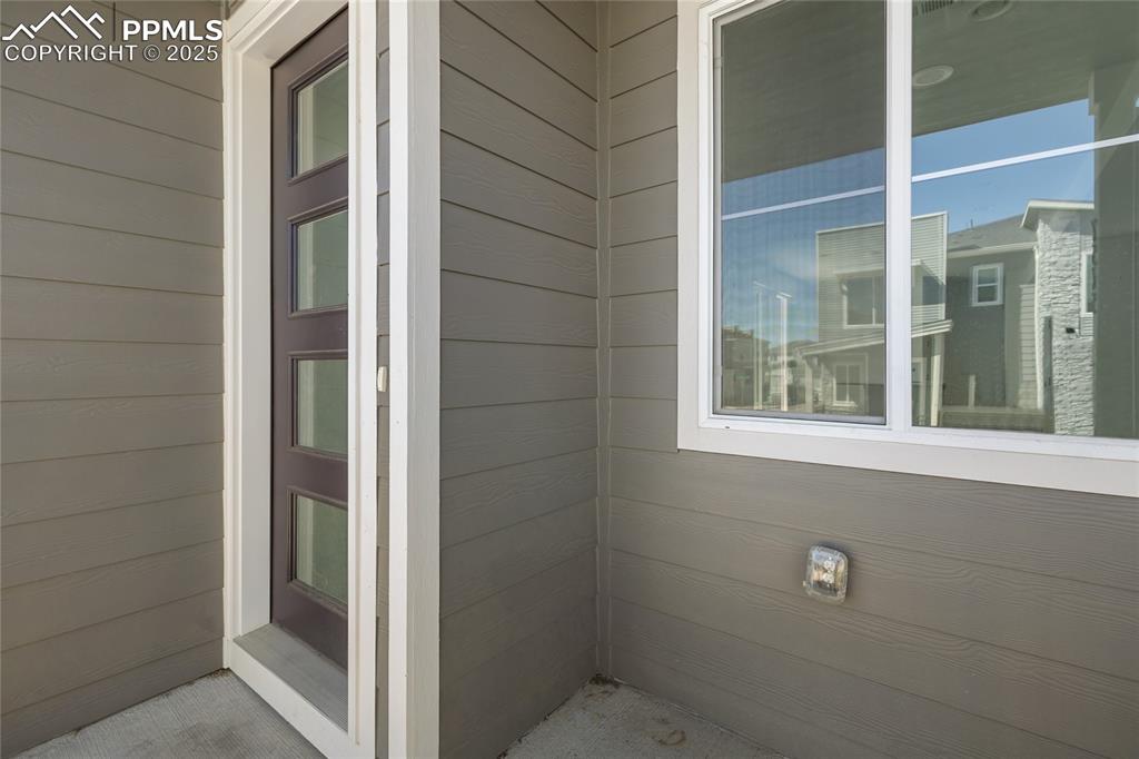 Image 34 of 37: Front covered patio