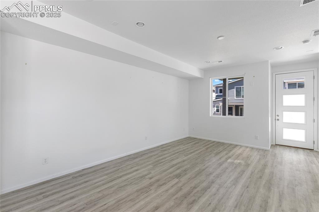 Image 5 of 37: Large living room with LVP flooring