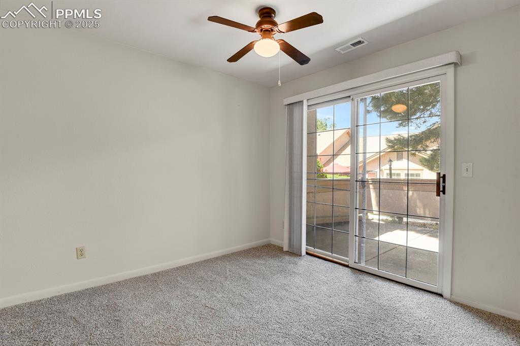 Image 7 of 23: Unfurnished room with light colored carpet and ceiling fan