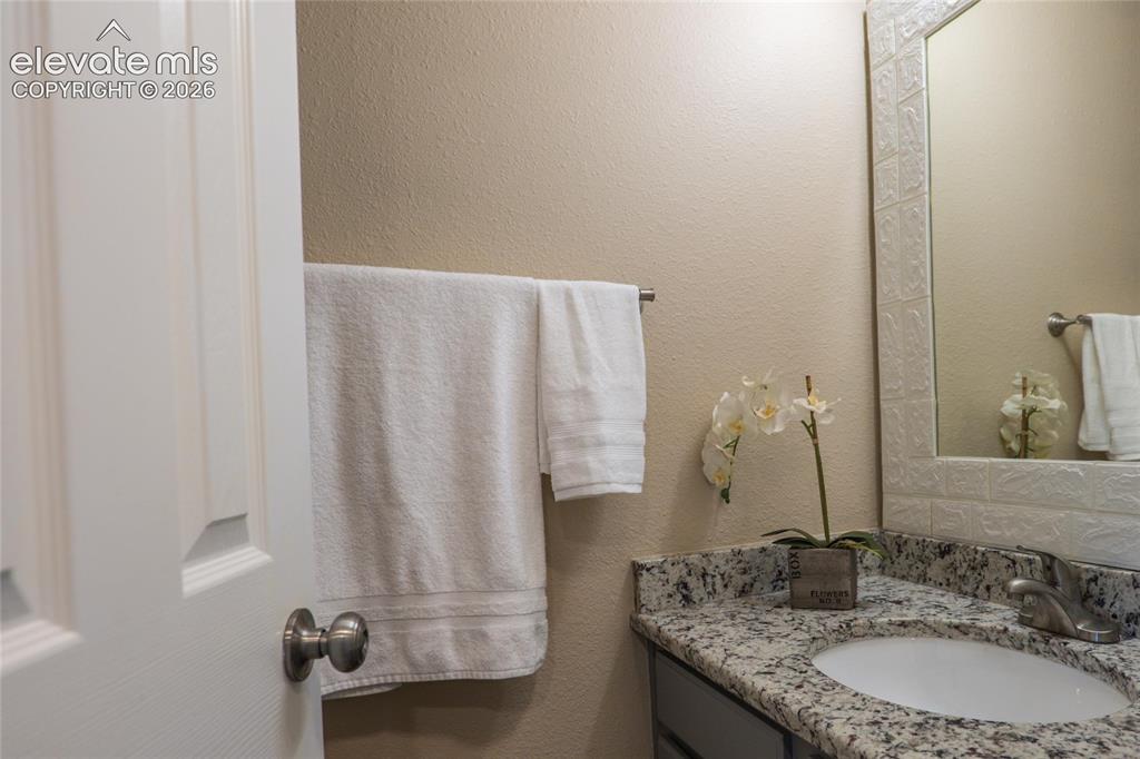 Image 10 of 18: Main level 1/2 bath.