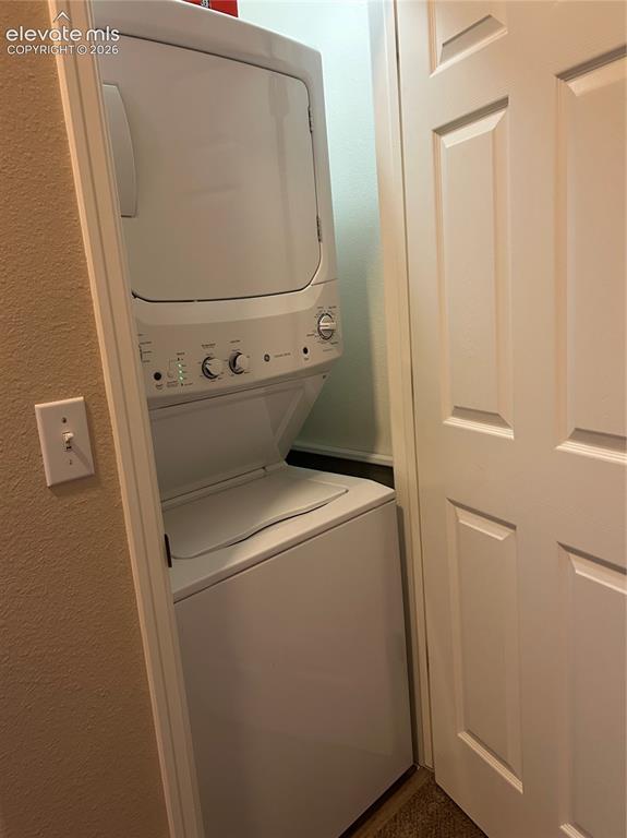 Image 14 of 18: Upper level stackable washer and dryer.