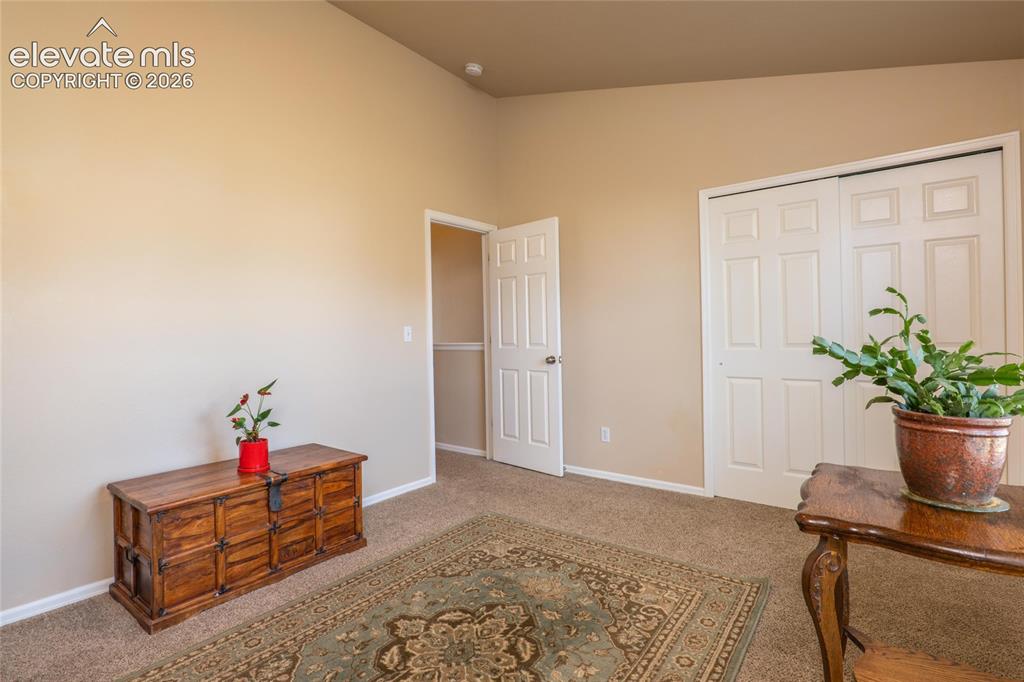 Image 15 of 18: Spacious 2nd upper level bedroom with vaulted ceiling.