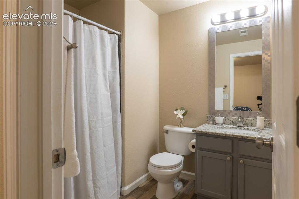 Image 16 of 18: 3/4 bathroom adjoining 3rd bedroom in the basement perfect for guests.