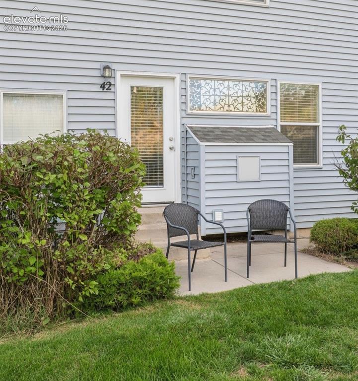 Image 8 of 18: Enjoy relaxing or grilling on the back patio.