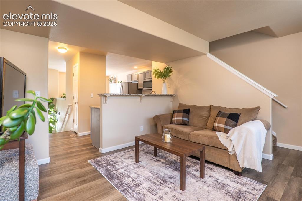 Image 9 of 18: Another view of the main level living room. There is also a convenient main