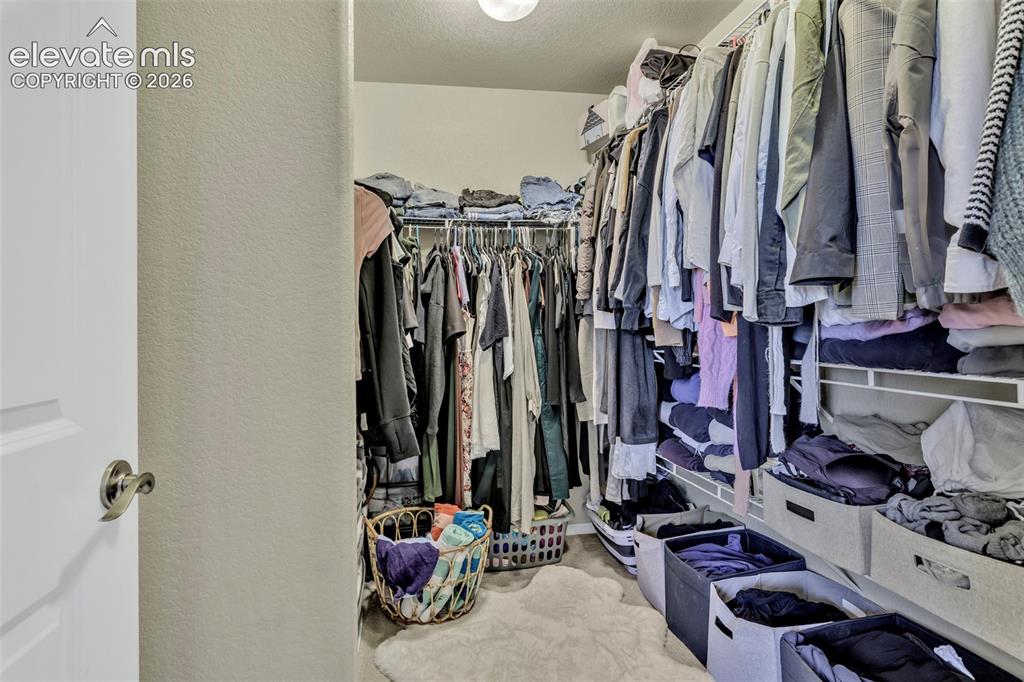 Image 21 of 25: Master Bedroom Closet