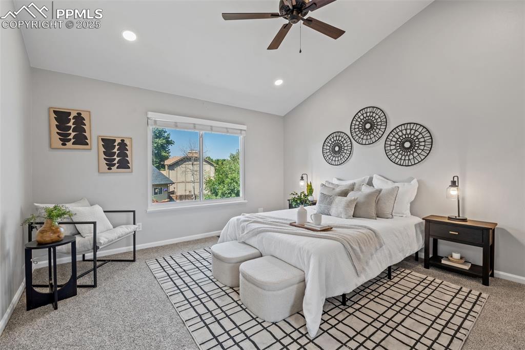 Image 20 of 40: Bedroom featuring light carpet, ceiling fan, recessed lighting, and high va