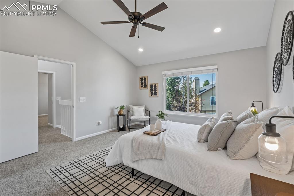 Image 24 of 40: Bedroom featuring light colored carpet, recessed lighting, ceiling fan, and