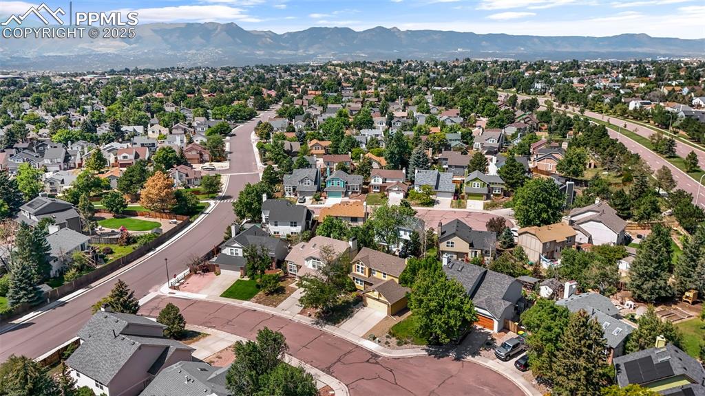Image 39 of 40: View of property location featuring nearby suburban area and a mountain bac