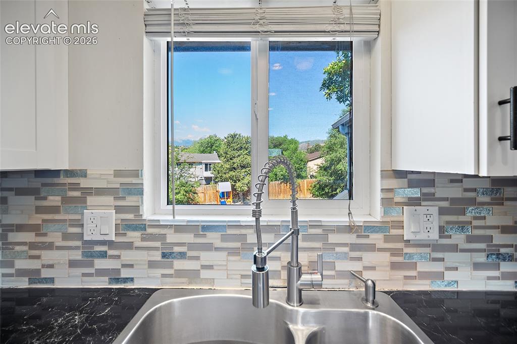 Image 12 of 50: Kitchen with scenic views.