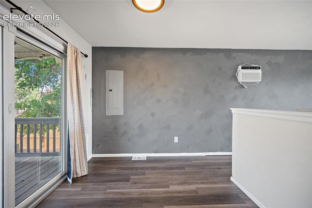 Image 14 of 50: Dining area off kitchen with a view of the deck