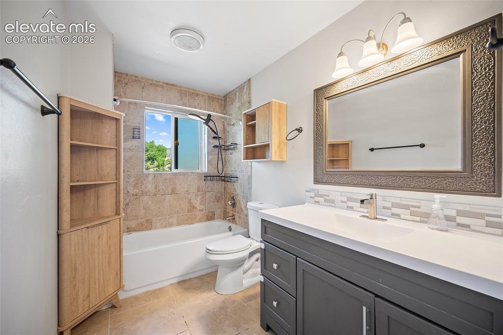 Image 15 of 50: Updated full bathroom with shower combination.