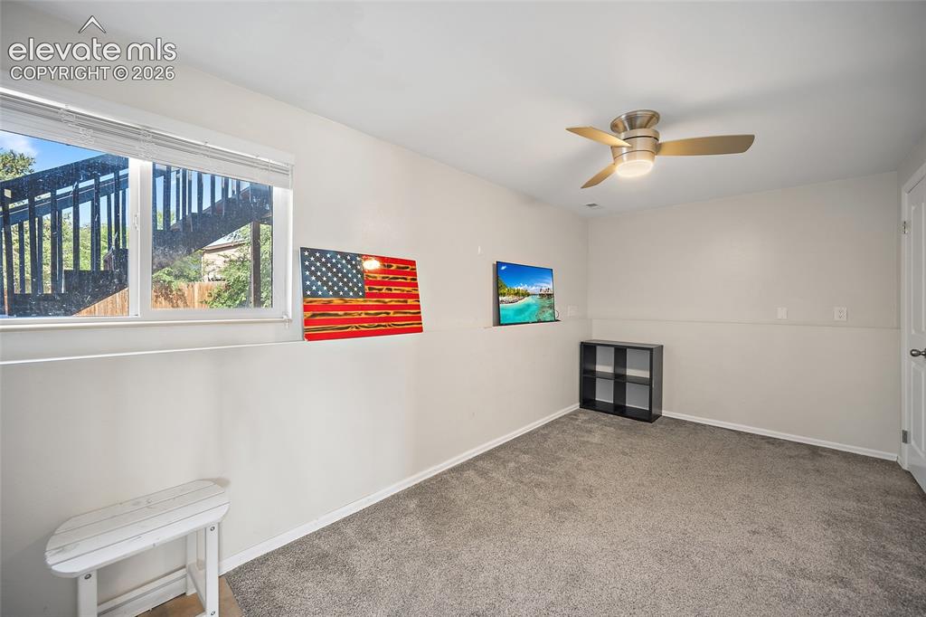 Image 23 of 50: Family room with large window and natural light.