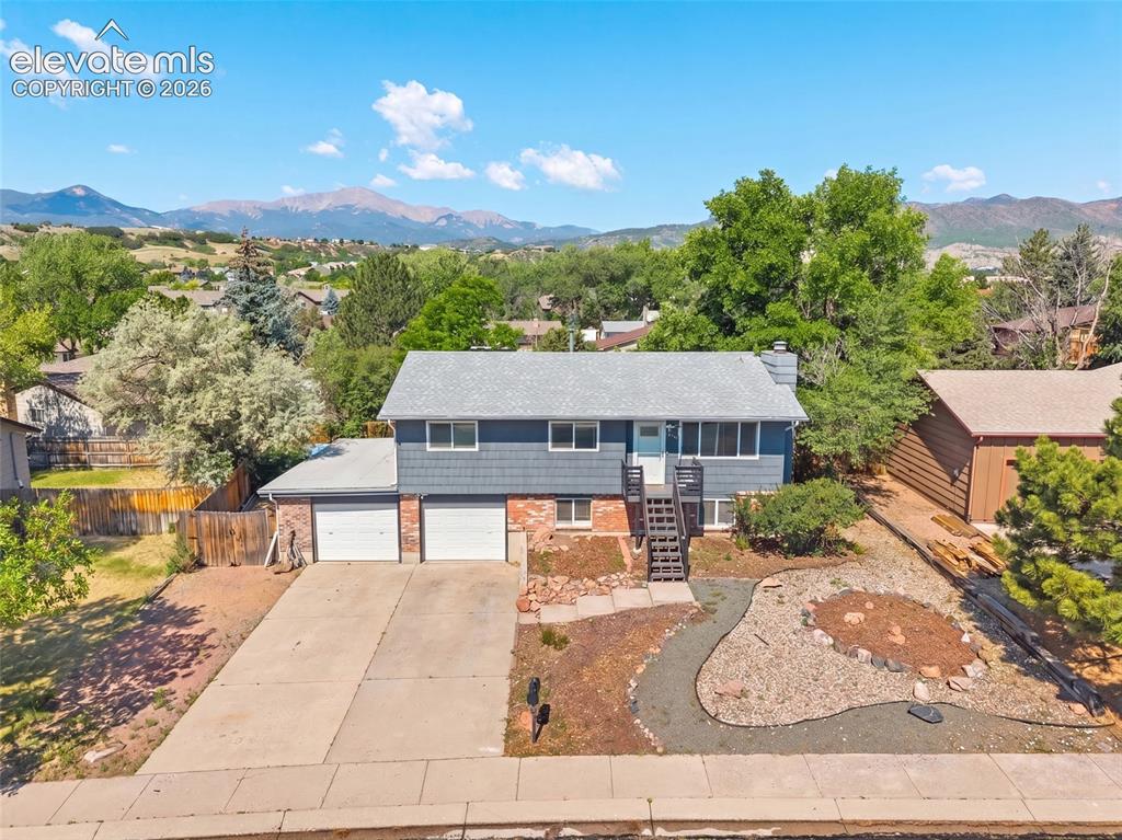 Image 42 of 50: Aerial view showcasing the home and stunning mountain views.