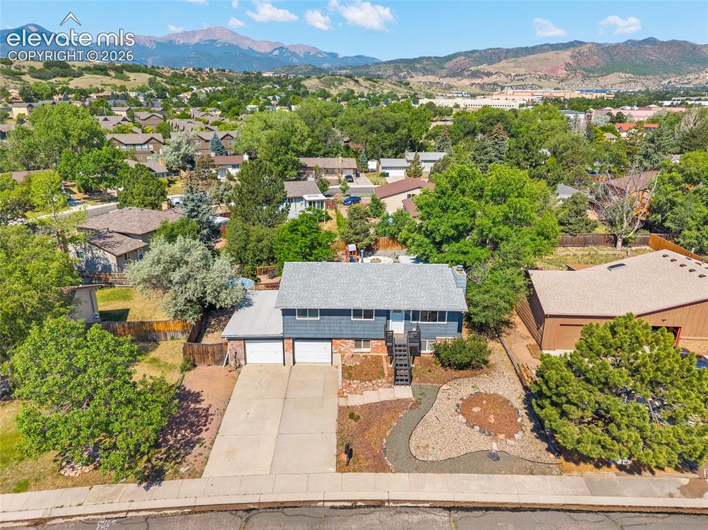 Image 43 of 50: Aerial view with panoramic mountain and neighborhood views.