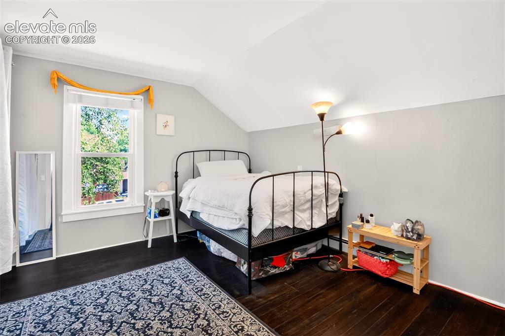 Image 19 of 30: Upper level guest bedroom