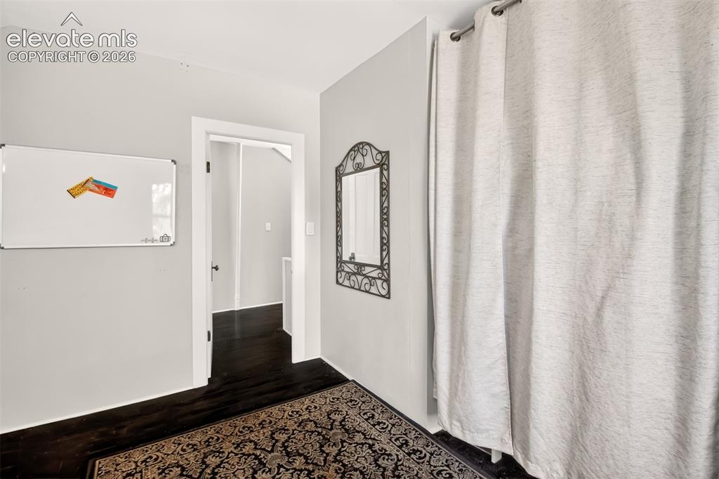 Image 20 of 30: Upper level guest bedroom and hallway