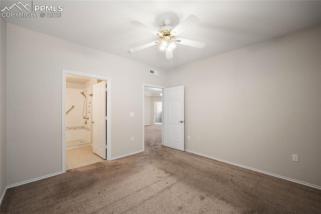 Image 19 of 31: Room featuring light-colored walls, ceiling fan with illumination, and plus