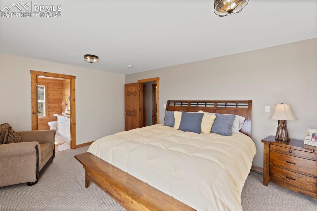 Image 19 of 41: The primary suite features two walk-in closets, a spa-like 5-piece bath wit