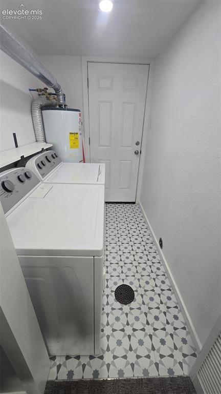 Image 11 of 43: Patterned tile flooring, recessed ceiling lighting, and a paneled door