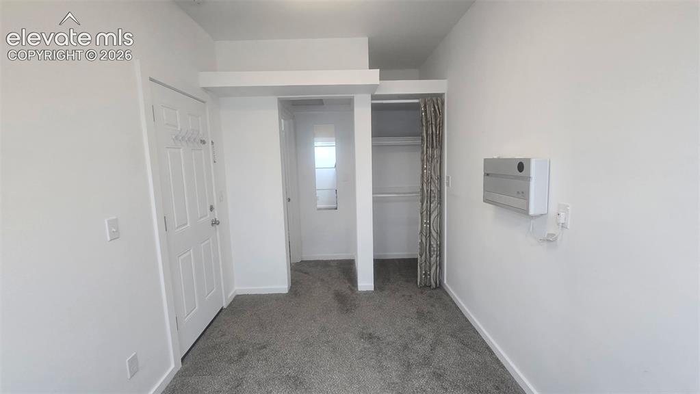 Image 21 of 43: Unit 2 Bedroom with entrance from garage on the left