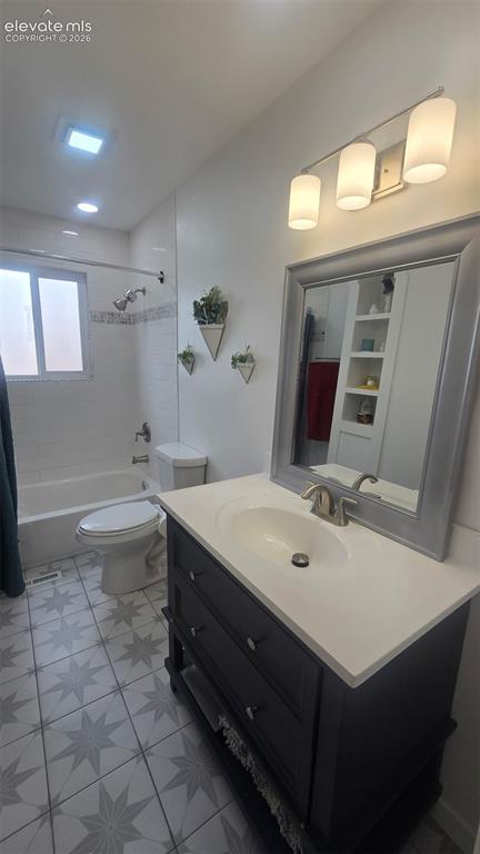 Image 8 of 43: Vanity with integrated sink and countertop, framed mirror, wall-mounted lig