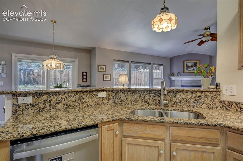 Image 10 of 50: Granite Counters and Backsplash.