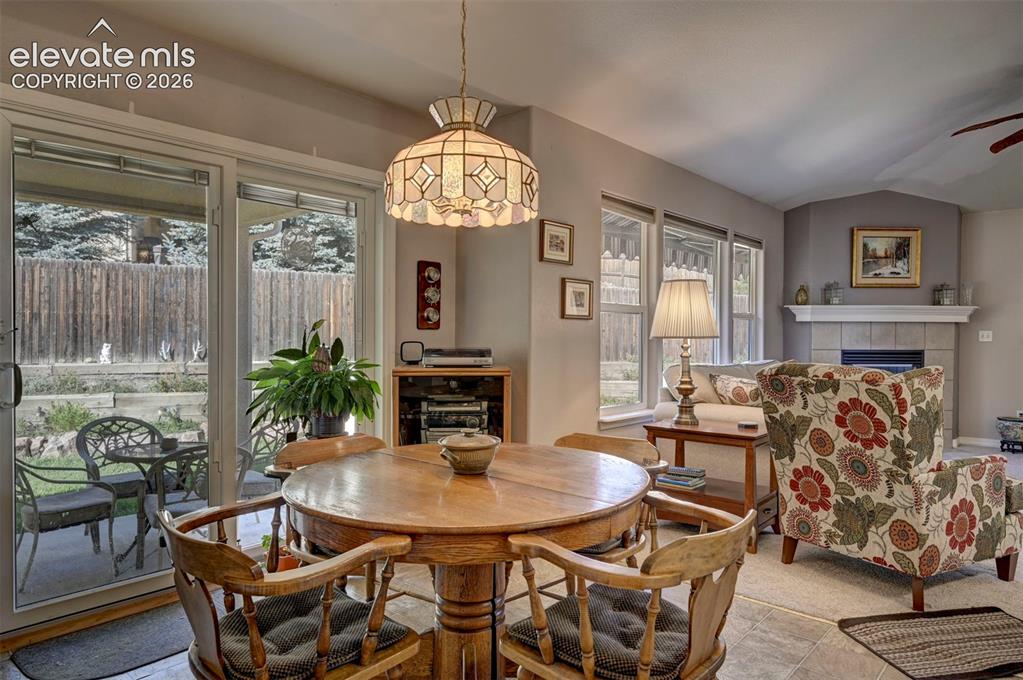 Image 16 of 50: Dining area over looking the living room.