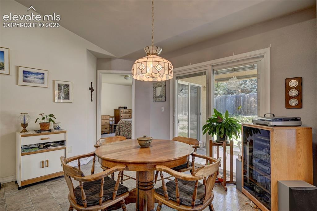 Image 17 of 50: Dining area with slider leading to backyard and patio area.