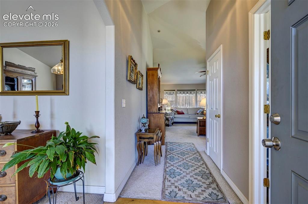 Image 18 of 50: View from the front door leading into the Living Room